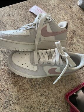 Nike Kids White Sneakers with Light Pink Swoosh